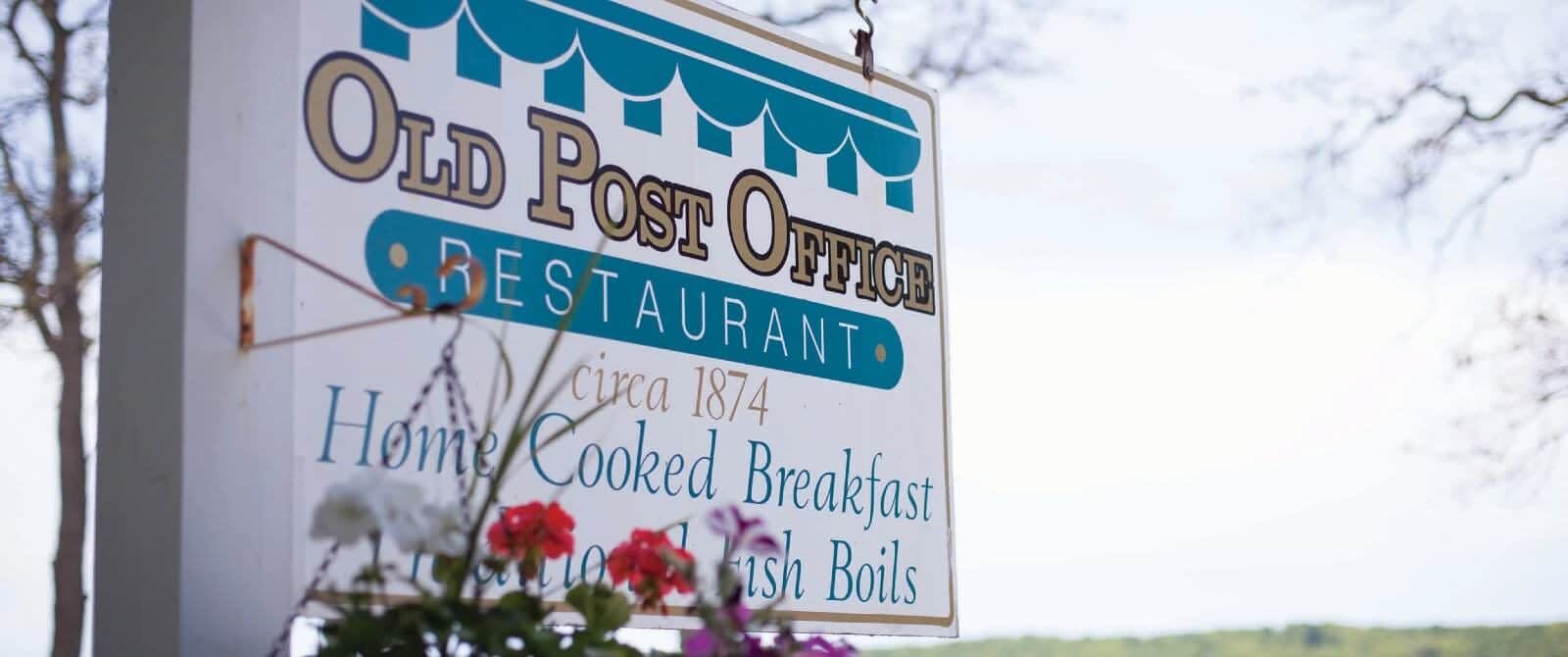 Blue and white business sign for the Old Post Office Restaurant